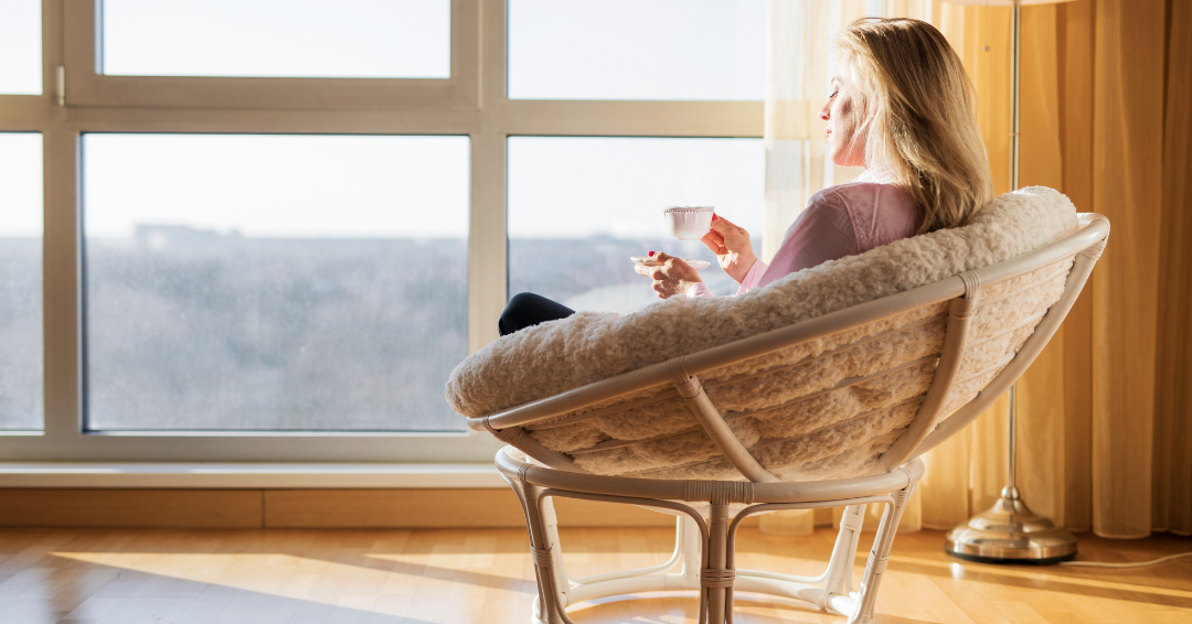 Woman Relaxing with Coffee in Chair