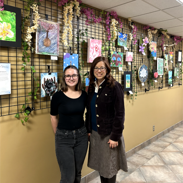 Artwork from The Cuyahoga Falls National Art Honor Society is the focus of our Community Art Showcase throughout February. Pictured, L to R: Kylie Dean, National Art Honor Society student and Jennifer Schulman, Art Teacher, Cuyahoga Falls High School