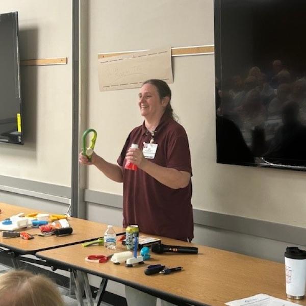 Kimberly Freborg, OTR/L, demonstrates arthritis tools